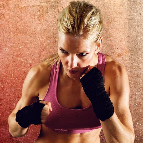 Mixed Martial Arts Lessons for Adults in Campbell CA - Lady Kickboxing Focused Background